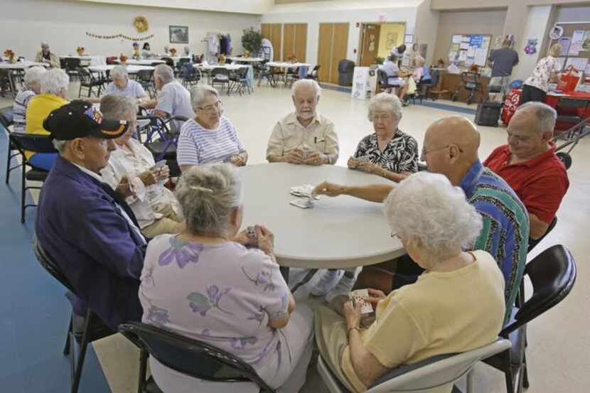 
Retired senior citizens gather for cards at the Citrus County Resource Center in Lecanto,...