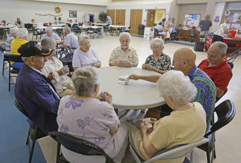 
Retired senior citizens gather for cards at the Citrus County Resource Center in Lecanto,...