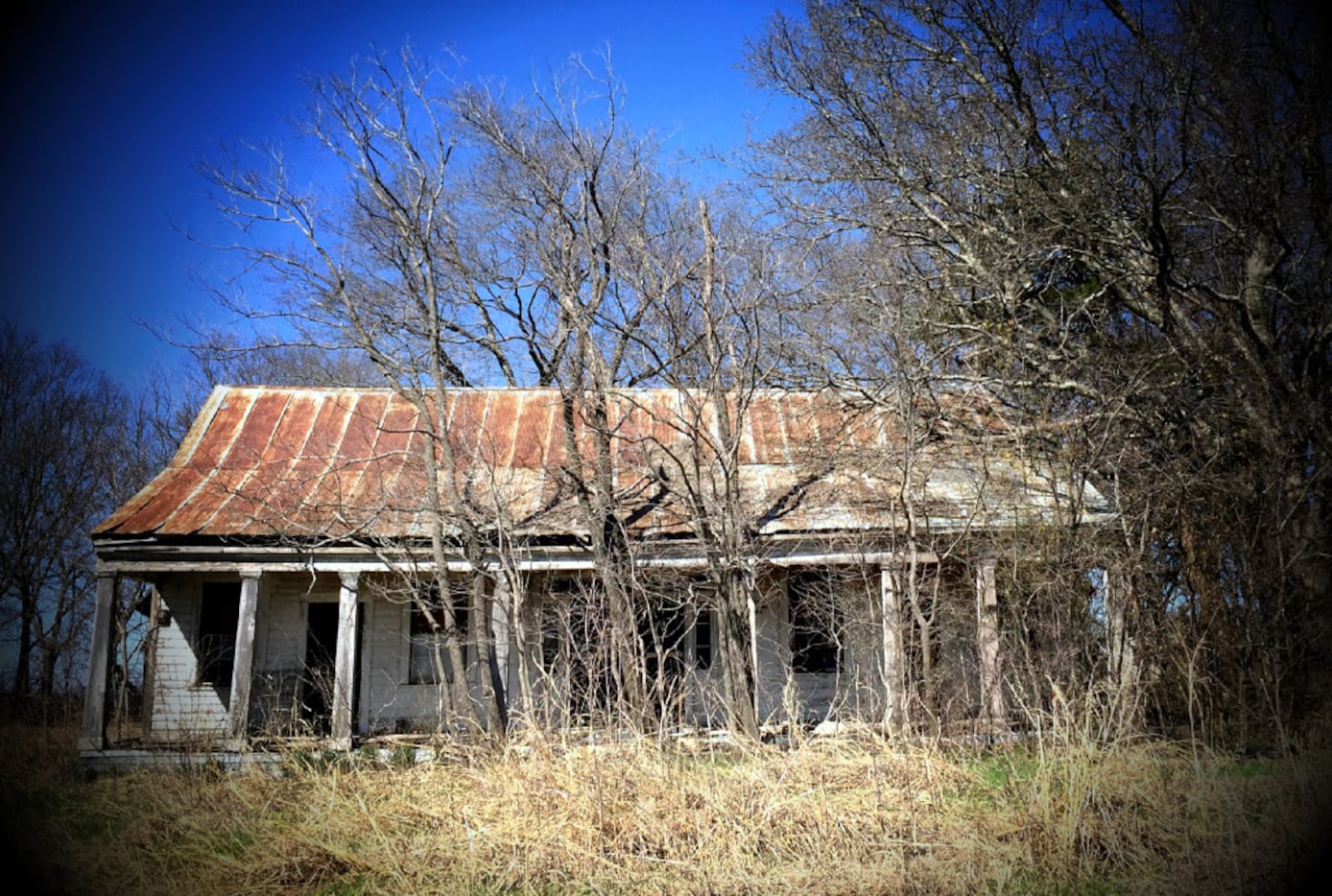 Exterior of an abandoned house on FM1743 near Windom in rural Fannin County. Photographed...