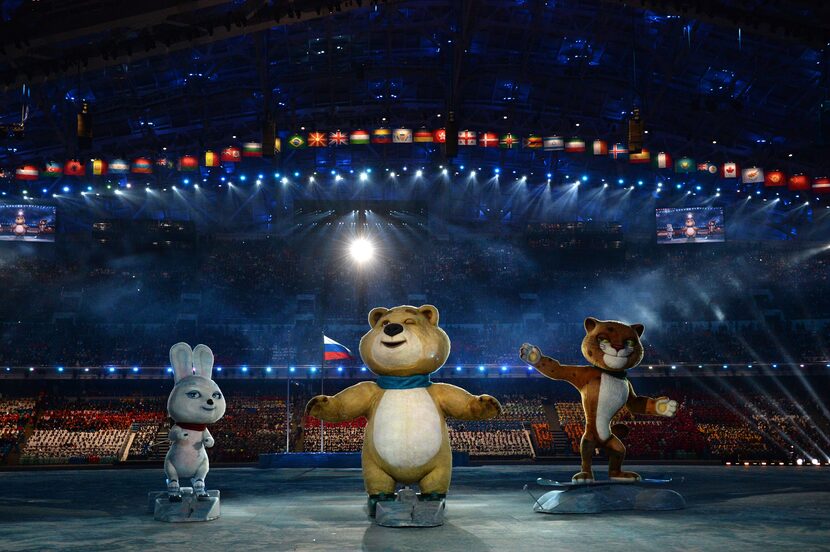 The Winter Games' official mascots, the Leopard, the Polar Bear and the Hare, perform during...