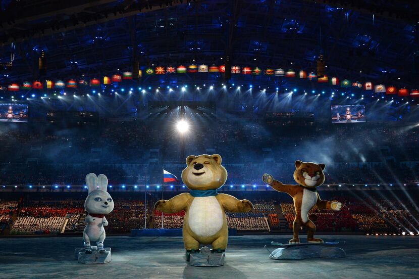 The Winter Games' official mascots, the Leopard, the Polar Bear and the Hare, perform during...