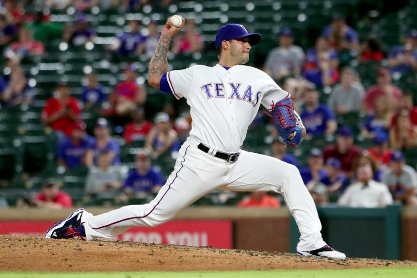 ARLINGTON, TX - JUNE 06:  Matt Bush #51 of the Texas Rangers pitches against the New York...