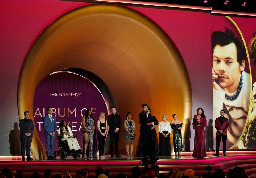 Super fans and Host Trevor Noah, front, present the award for album of year at the 65th...