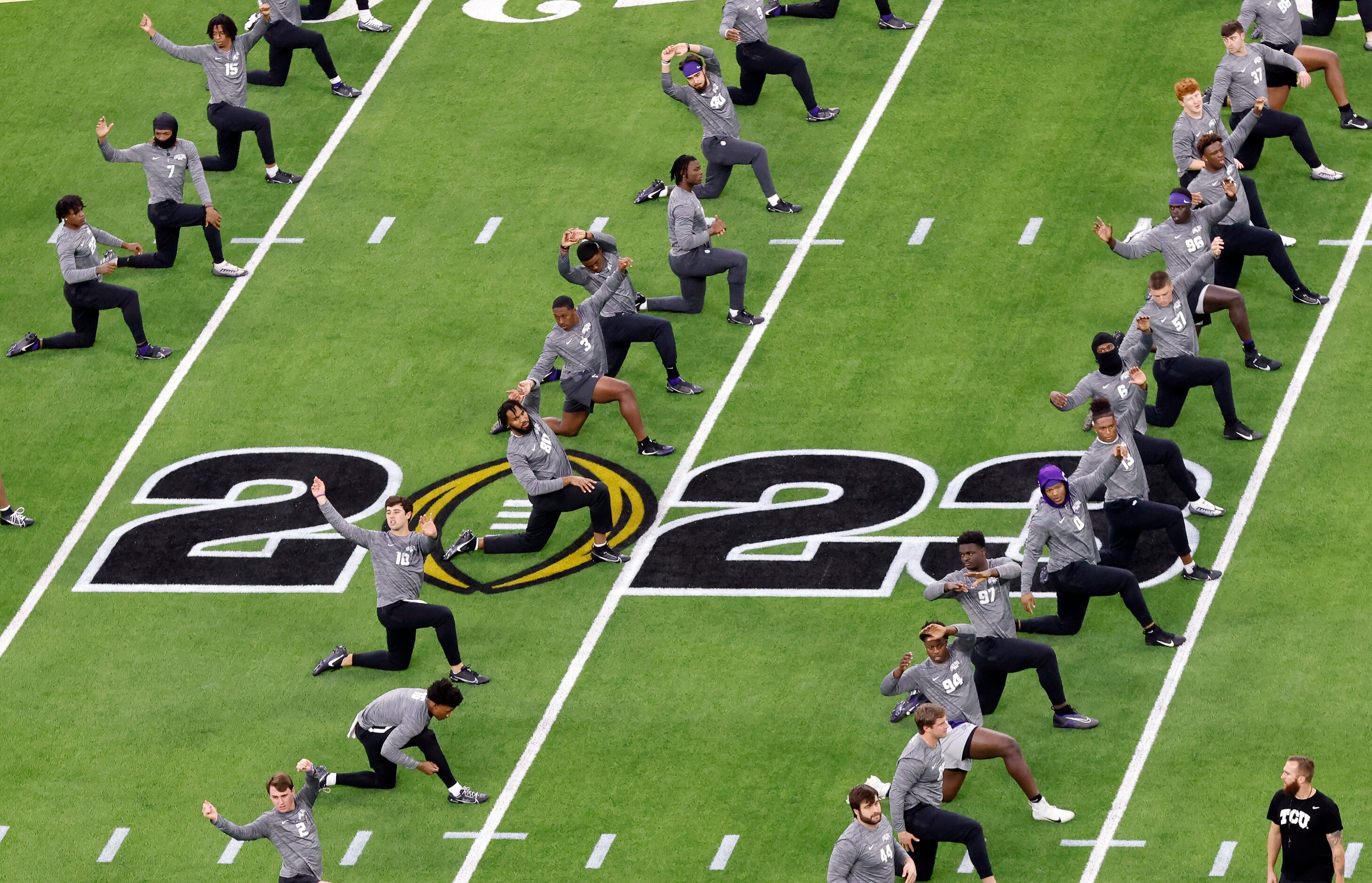 The TCU Horned Frogs football players warm up before facing the Georgia Bulldogs for the CFP...