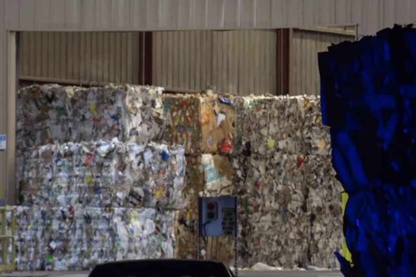 Bales of recycled material sit at a warehouse in East Fort Worth where a woman was killed...