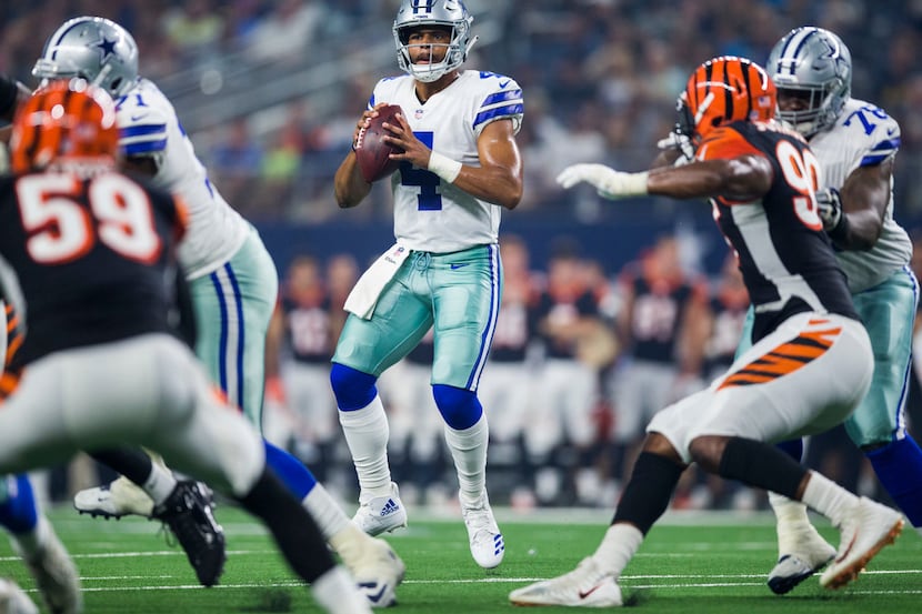 Dallas Cowboys quarterback Dak Prescott (4) looks for a receiver during the second quarter...