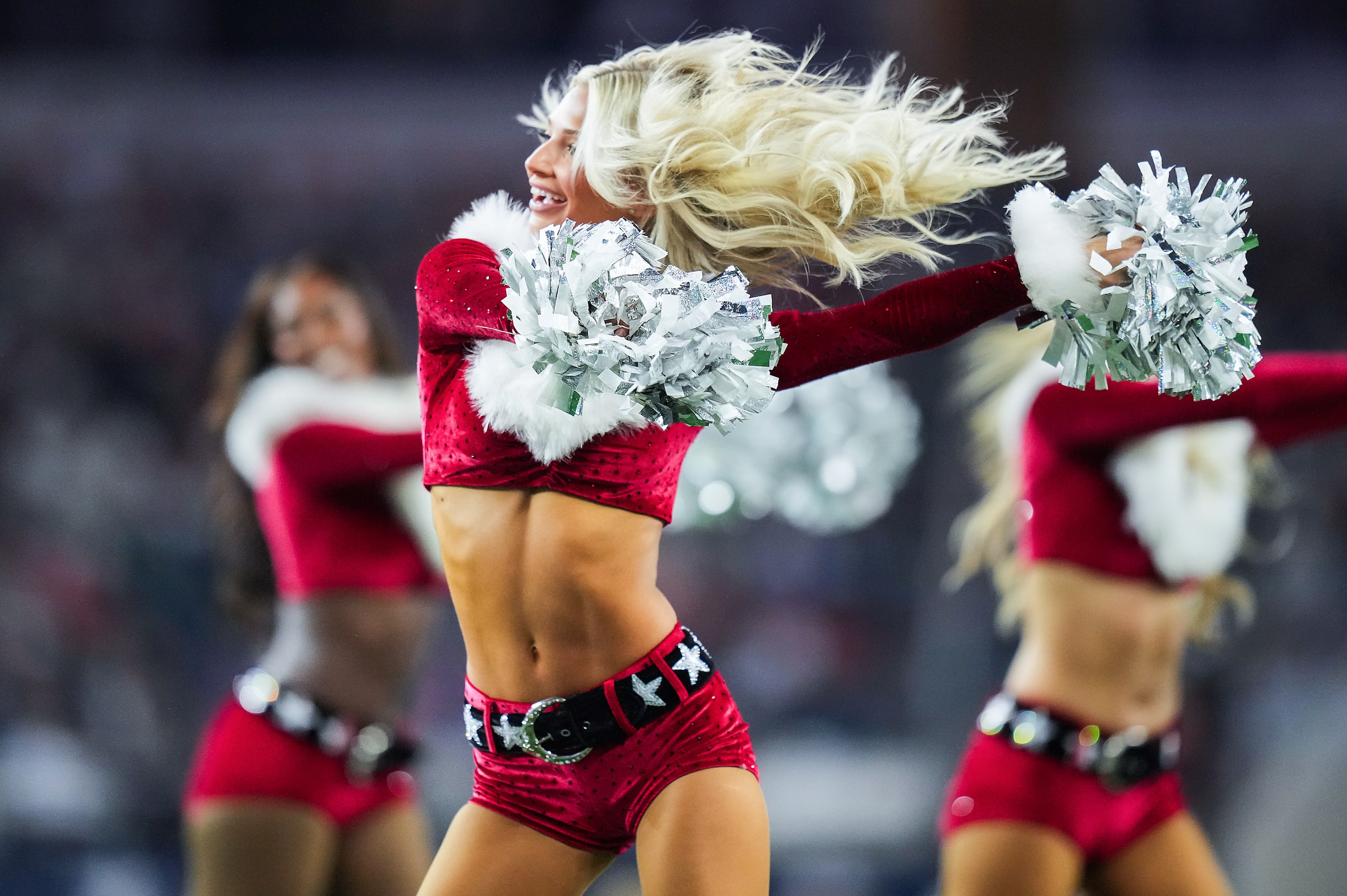 Dallas Cowboys Cheerleaders perform during the second half of an NFL football game against...