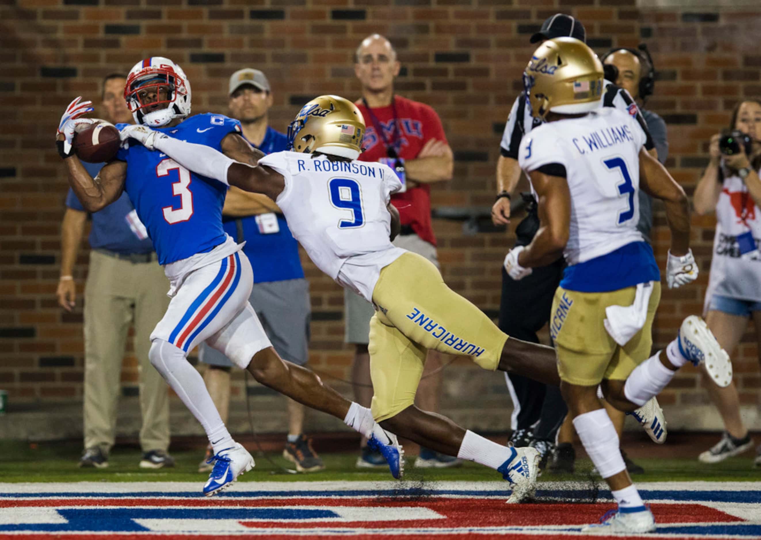 SMU Mustangs wide receiver James Proche (3) catches a pass in the end zone for a touchdown...
