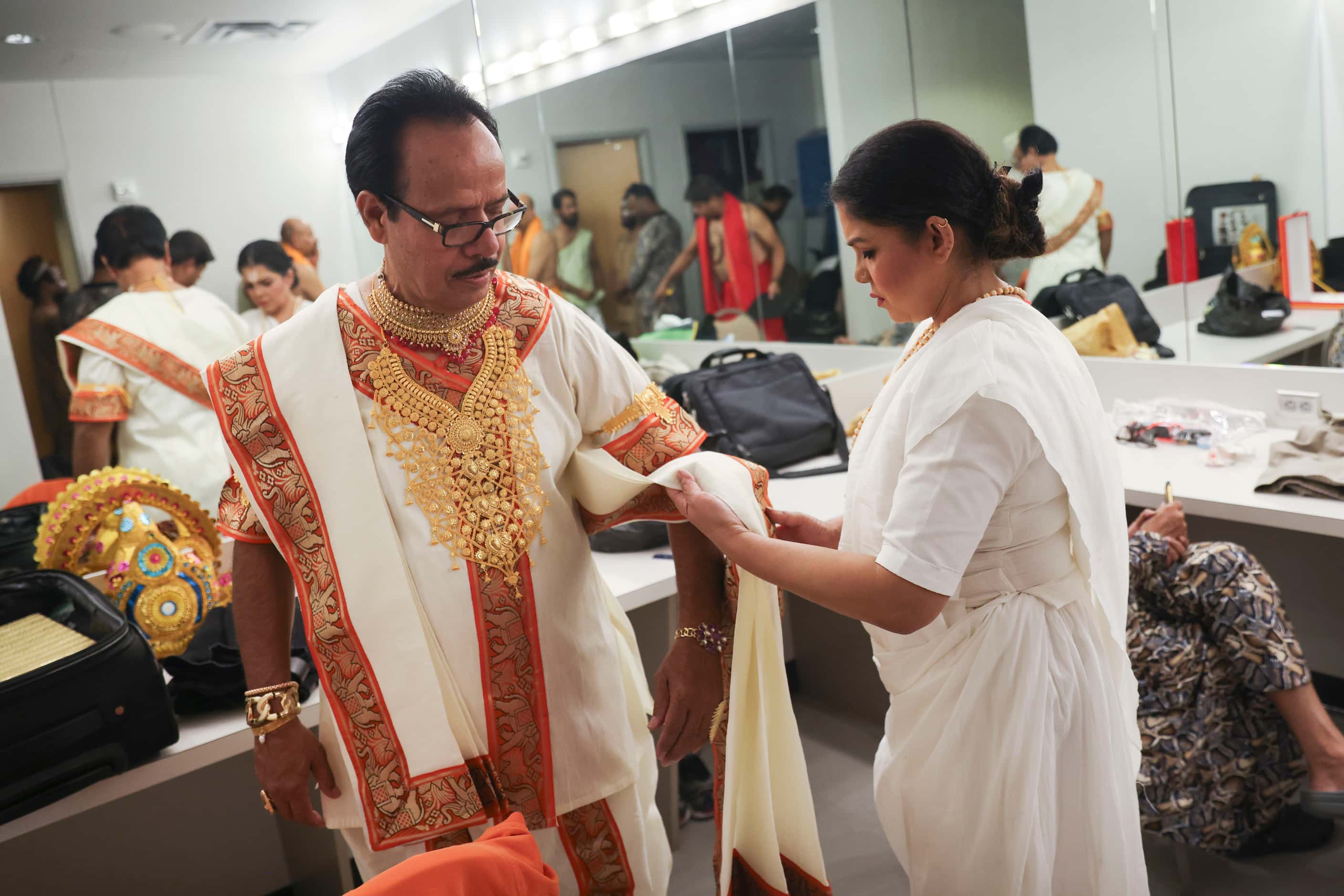 Cast members Md Mohiuddin, playing the role of Indra, get his outfit fixed in the dressing...
