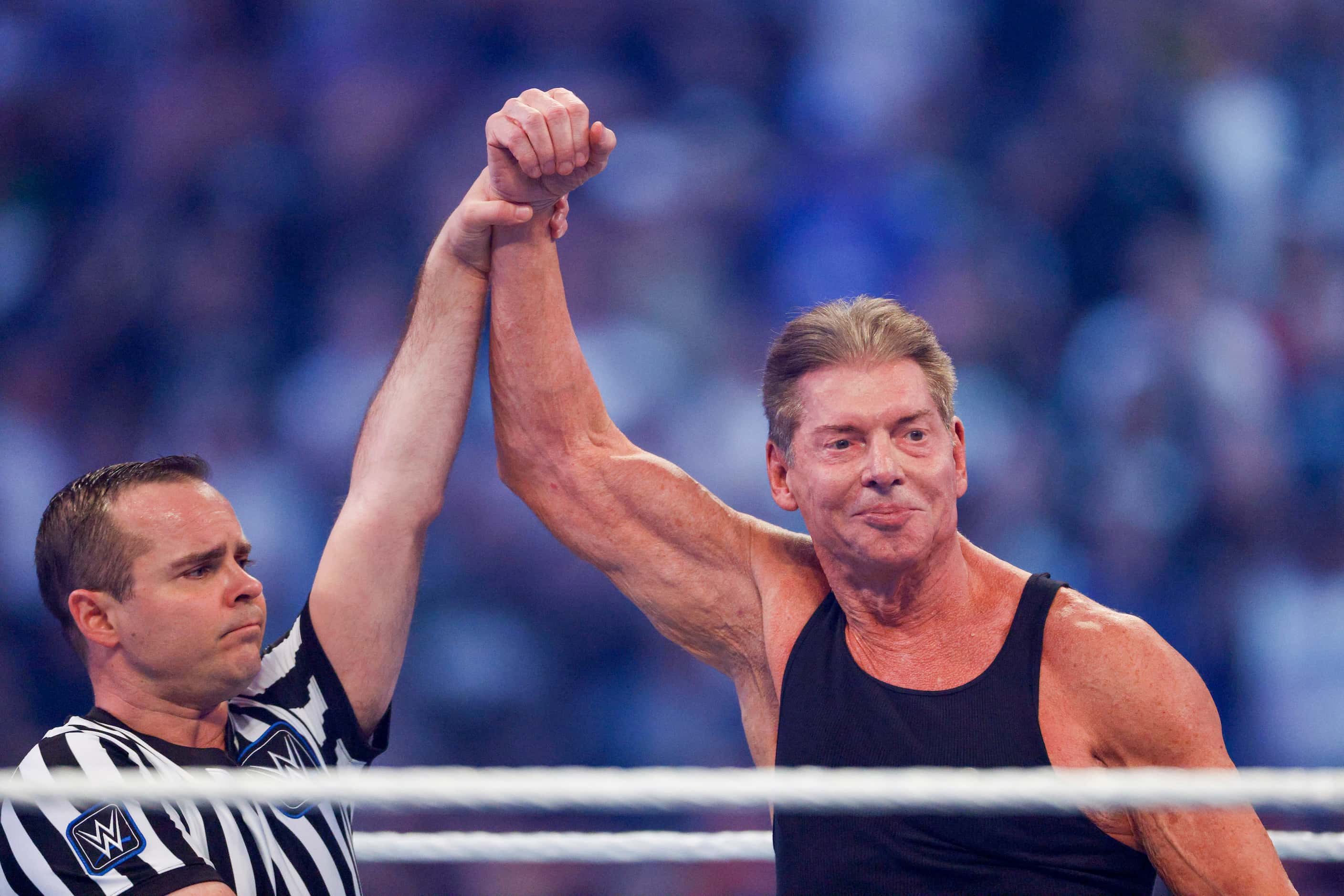 Vince McMahon raises his arm in victory after a match against Pat McAfee at WrestleMania...