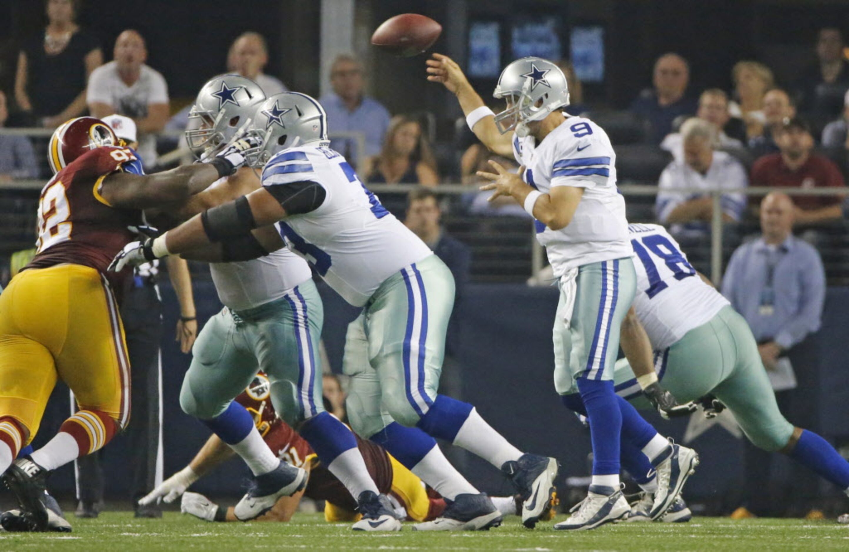 Dallas Cowboys quarterback Tony Romo (9) throws a pass in the fourth quarter during the...