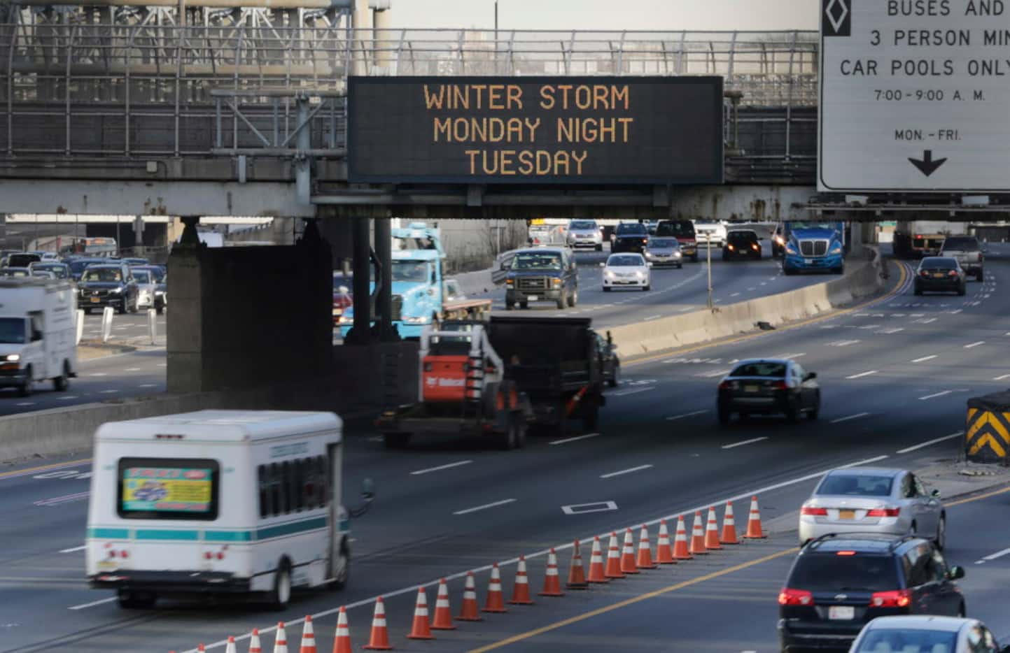 A sign warns motorists about an impending winter storm in Fort Lee, N.J., Monday, March 13,...