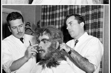  Actor Boris Karloff sits as studio make-up chief Bud Westmore, right, and make-up artist...