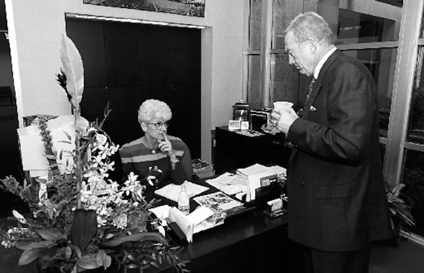  1-28-94: Dallas Cowboy's owner Jerry Jones  (R) listens to his personal secretary, Marylyn...