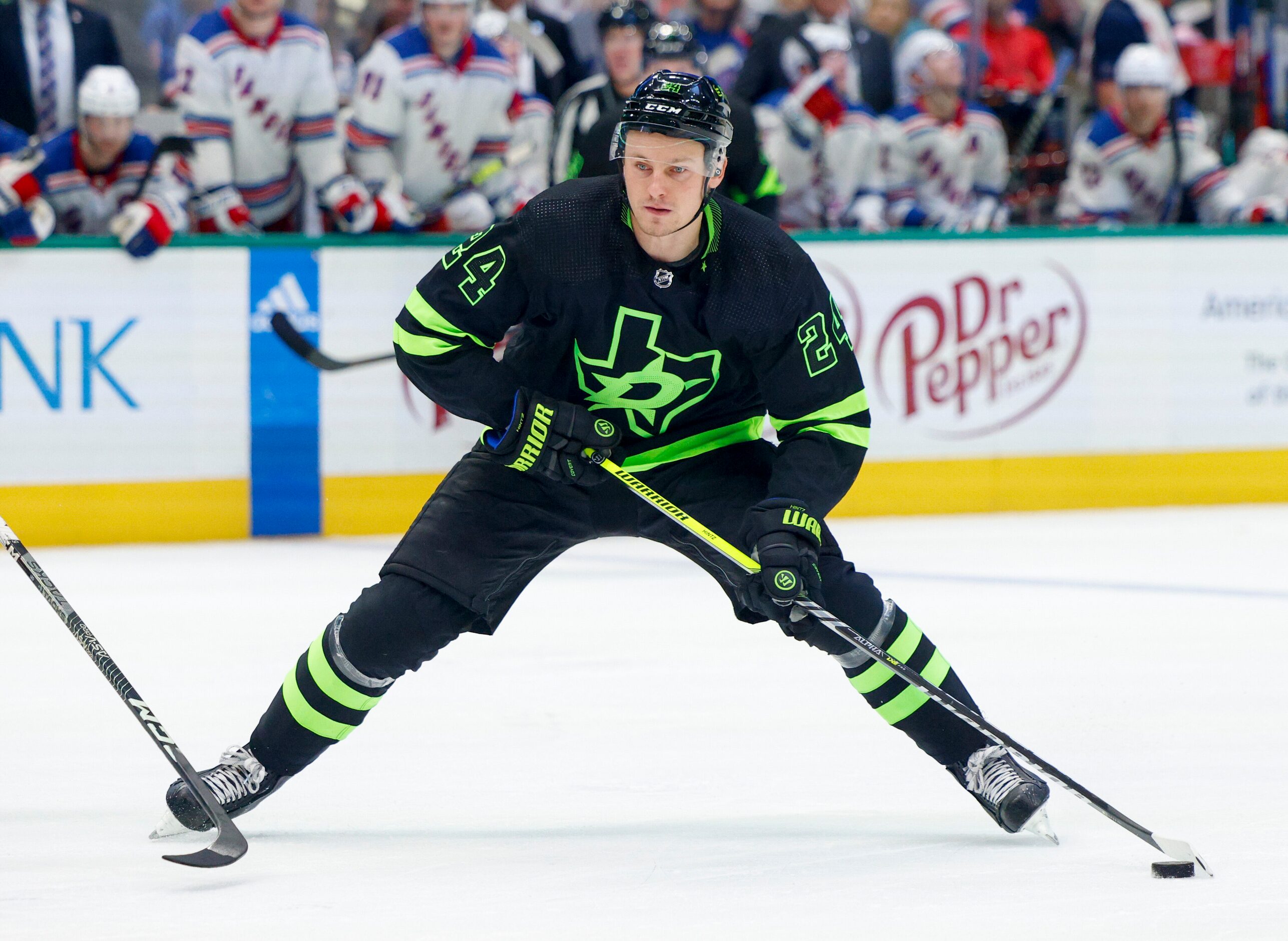 Dallas Stars center Roope Hintz (24) handles the puck during the third period of an NHL...