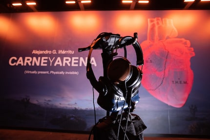 A pair of headphones and a virtual reality eye set that are used at the exhibit hang inside...