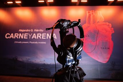 A pair of headphones and a virtual reality eye set that are used at the exhibit hang inside...