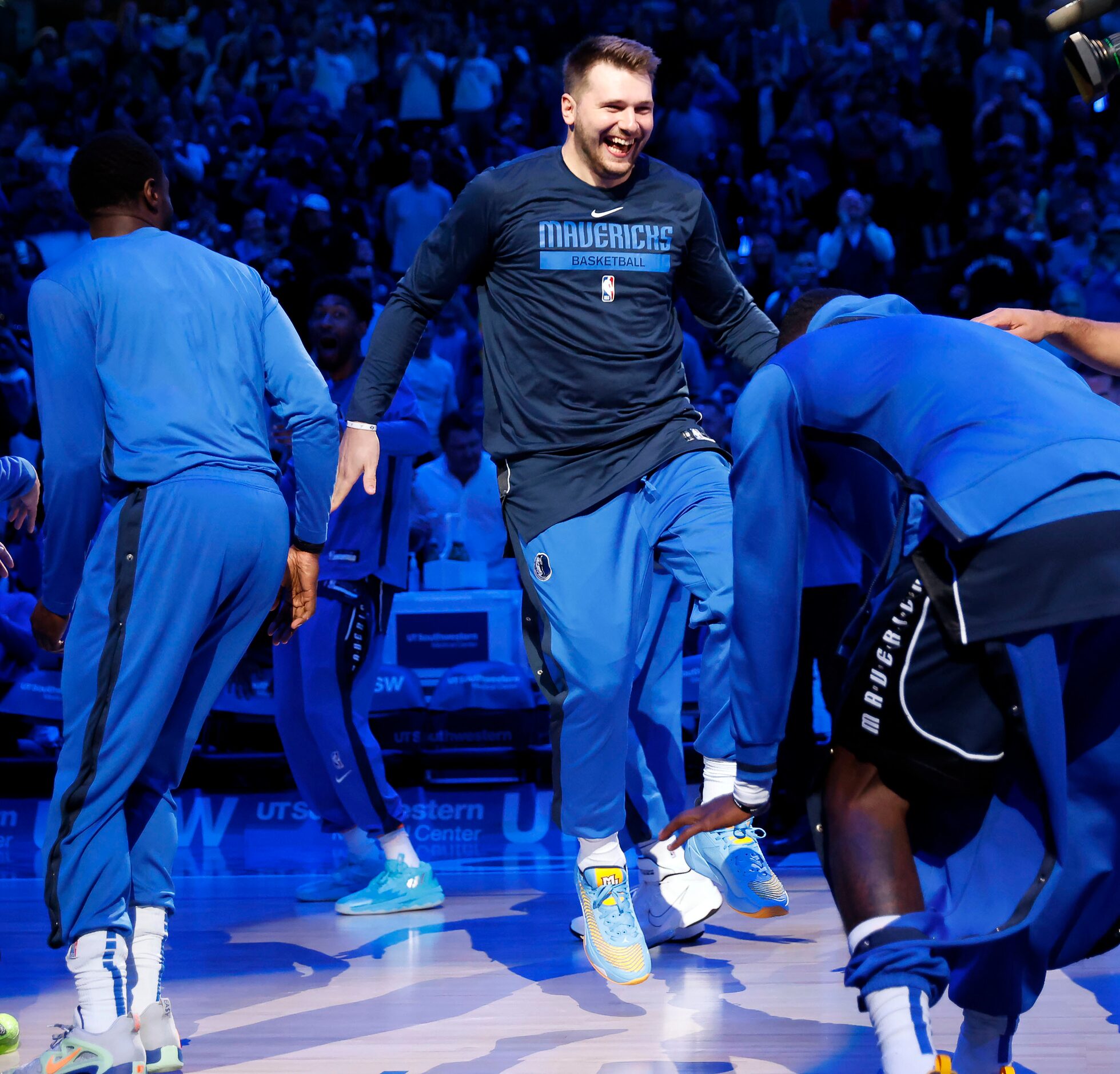 Dallas Mavericks guard Luka Doncic (77) skips onto the court during player introductions...