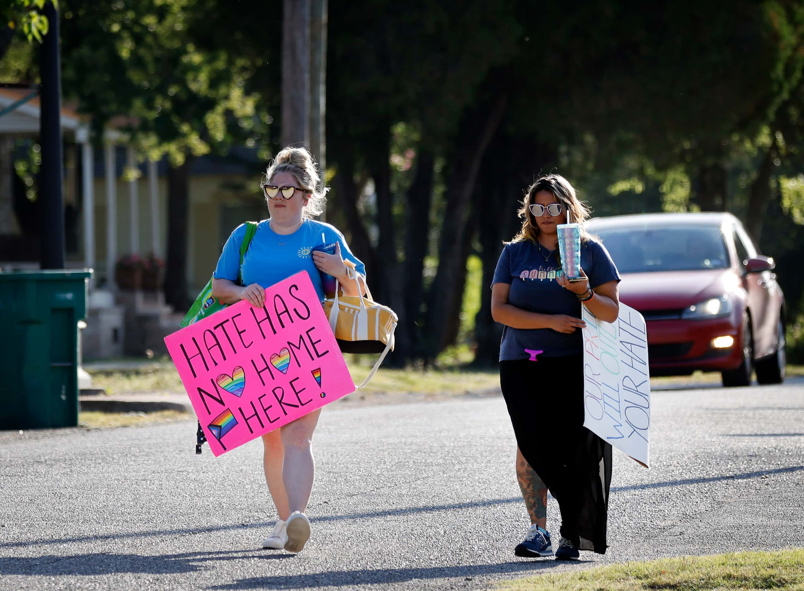 New No Hate In Texas protestors Samantha Ledbetter (left) and Crystal Ramirez arrive at at...