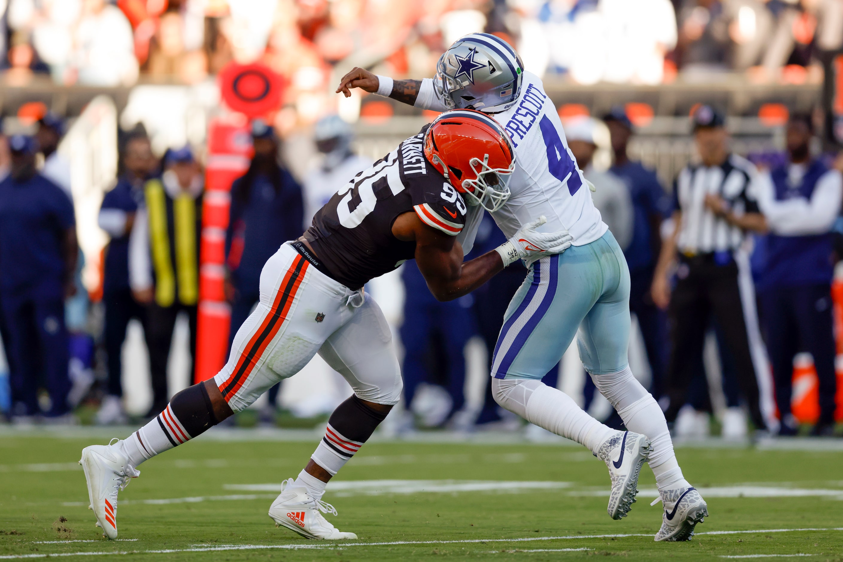 Cleveland Browns defensive end Myles Garrett (95) hits Dallas Cowboys quarterback Dak...