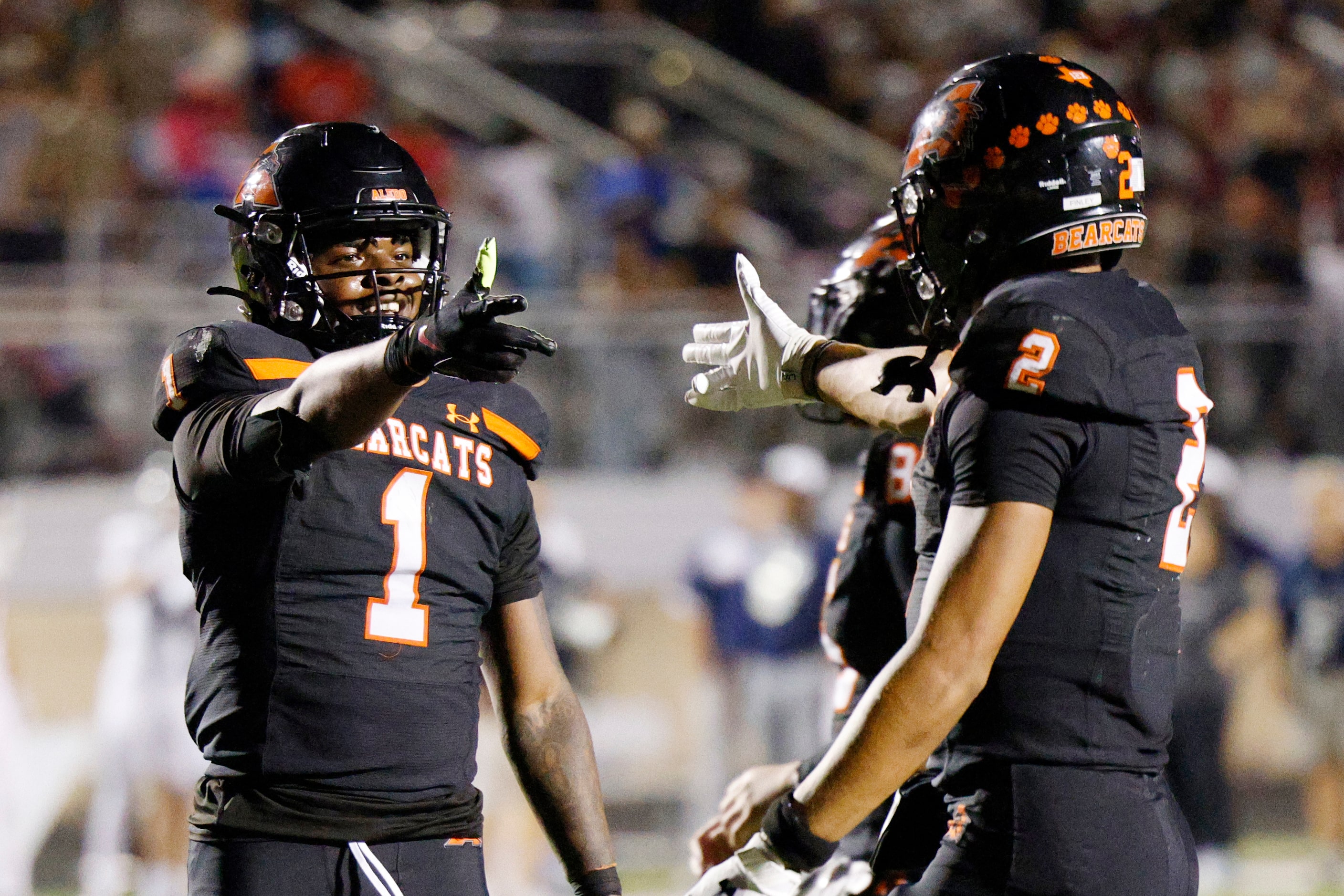 Aledo running back Raycine Guillory Jr. (1) celebrates his touchdown with wide receiver...