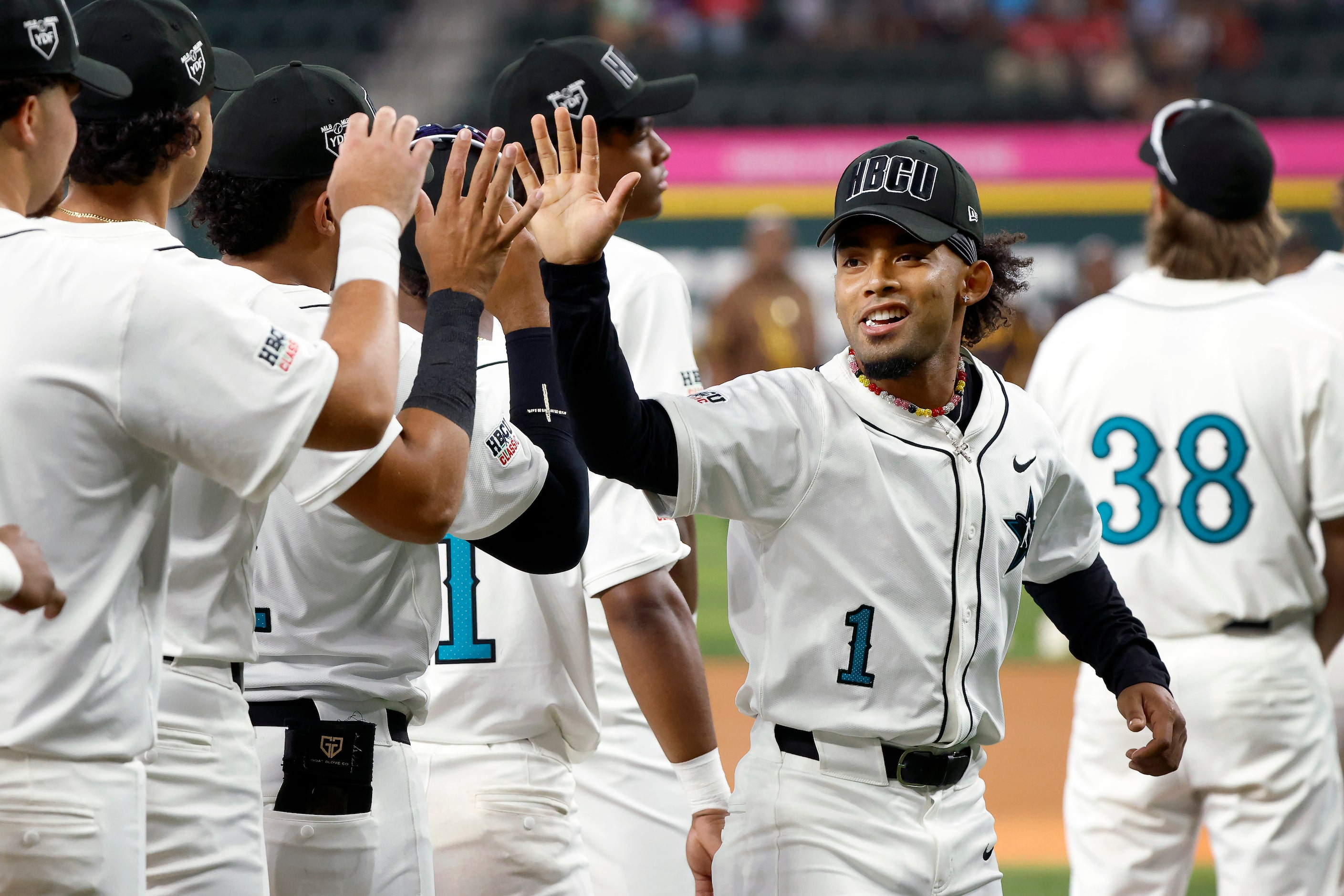 American League player Tiger Borom (1) is fired up during player introductions before the...