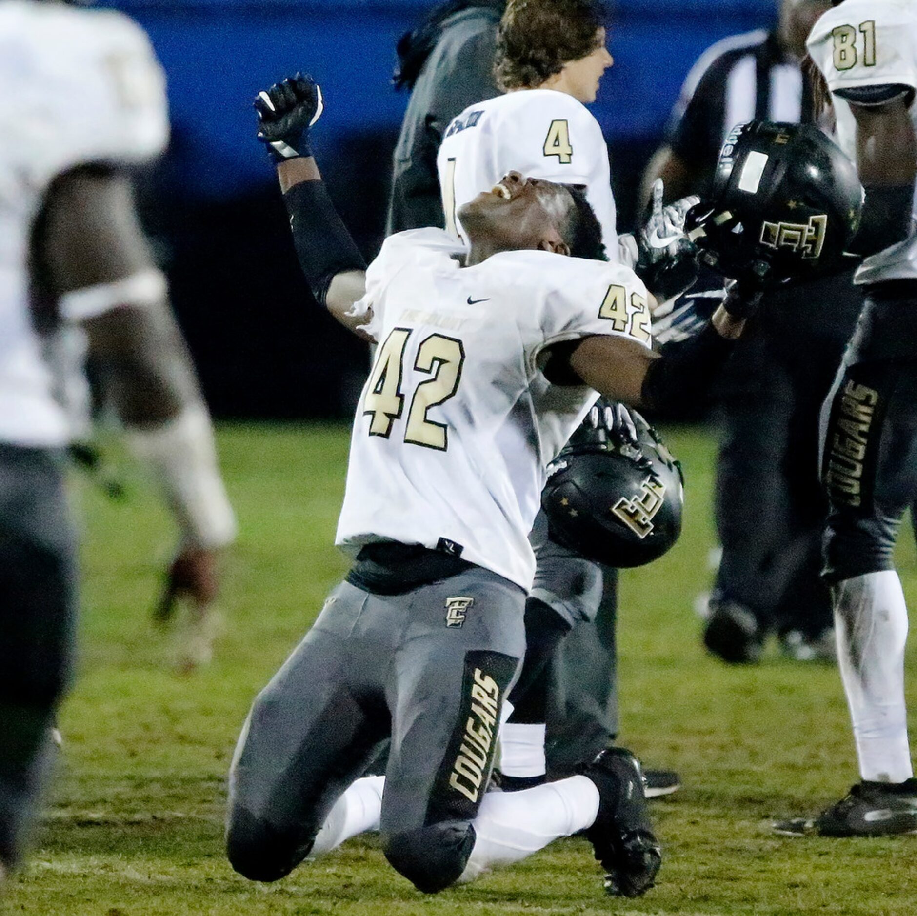 The Colony High School Kyair Warner (42) falls to his knees after a thrilling finish victory...