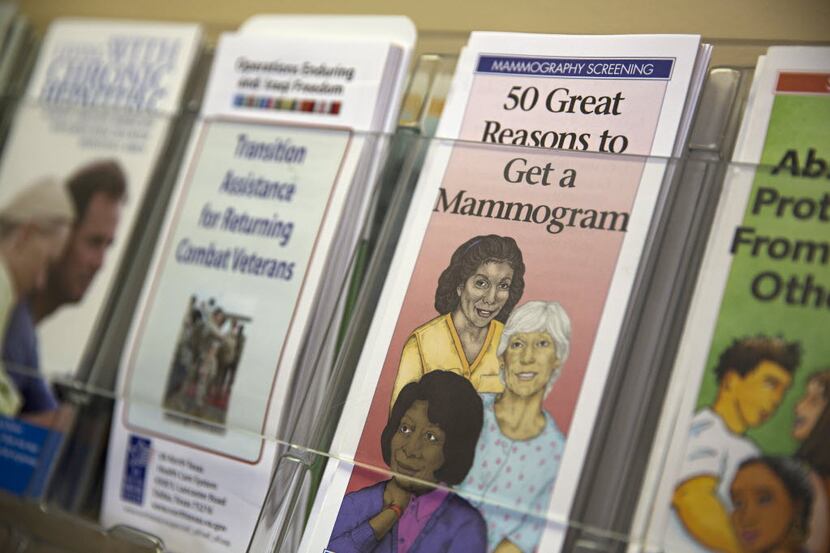 A pamphlet about mammograms sits among others on a wall display at the Urban Inter-Tribal...