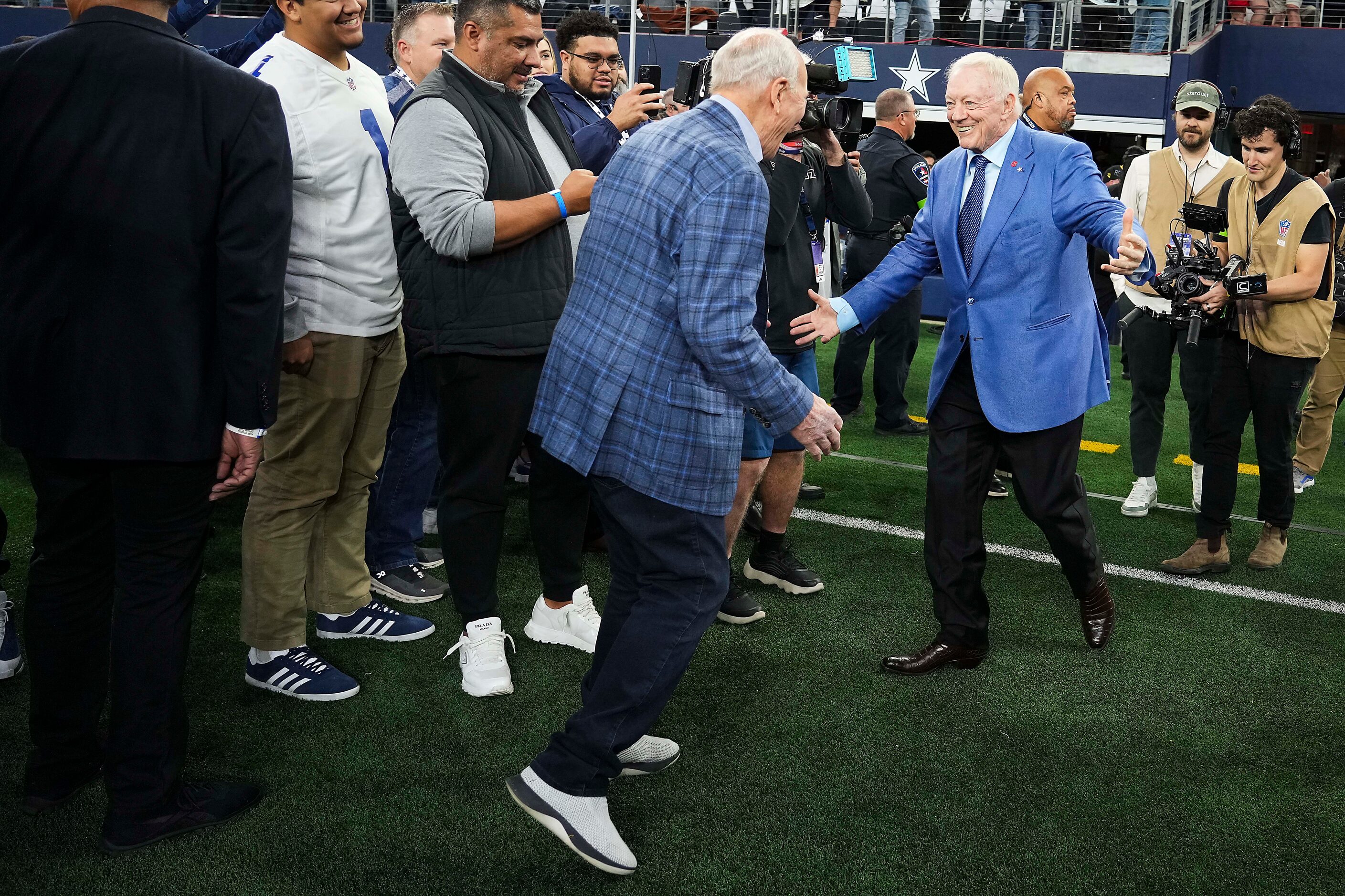 Dallas Cowboys owner and general manager Jerry Jones (right) greets former Cowboys and...