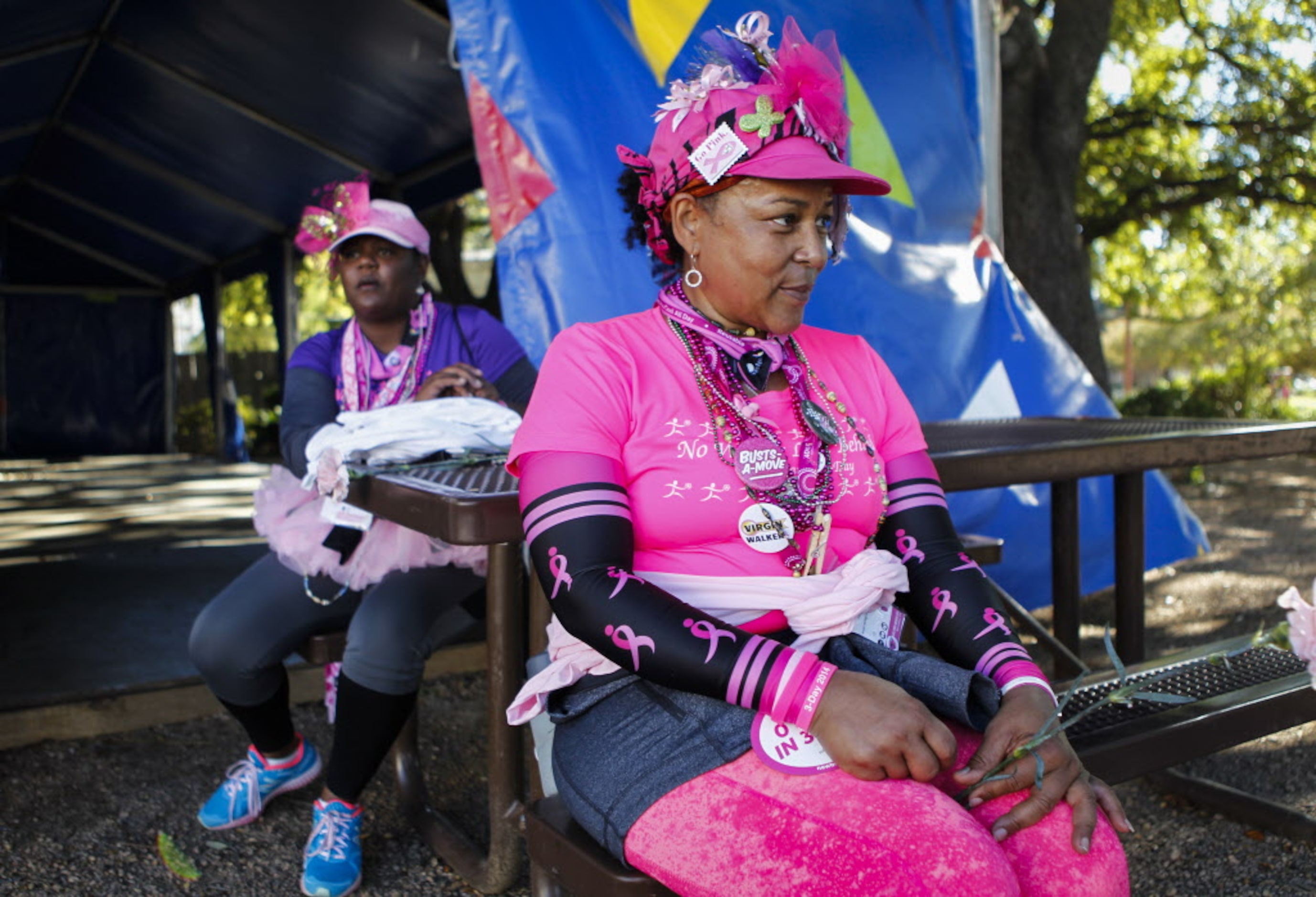 Breast cancer survivor Lucinda Johnson (foreground) and her walking teammate Brenda Simmons,...