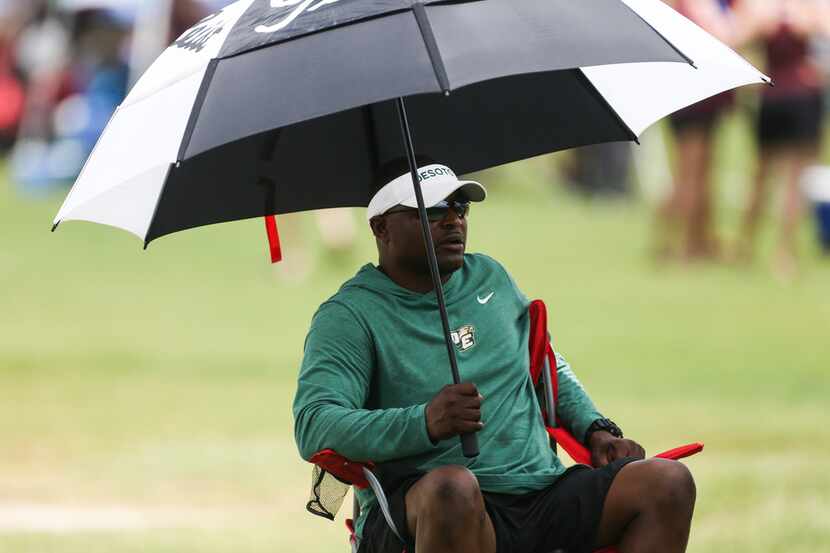 DeSoto coach Claude Mathis sits on the sidelines during the 2019 Texas 7on7 Championship...