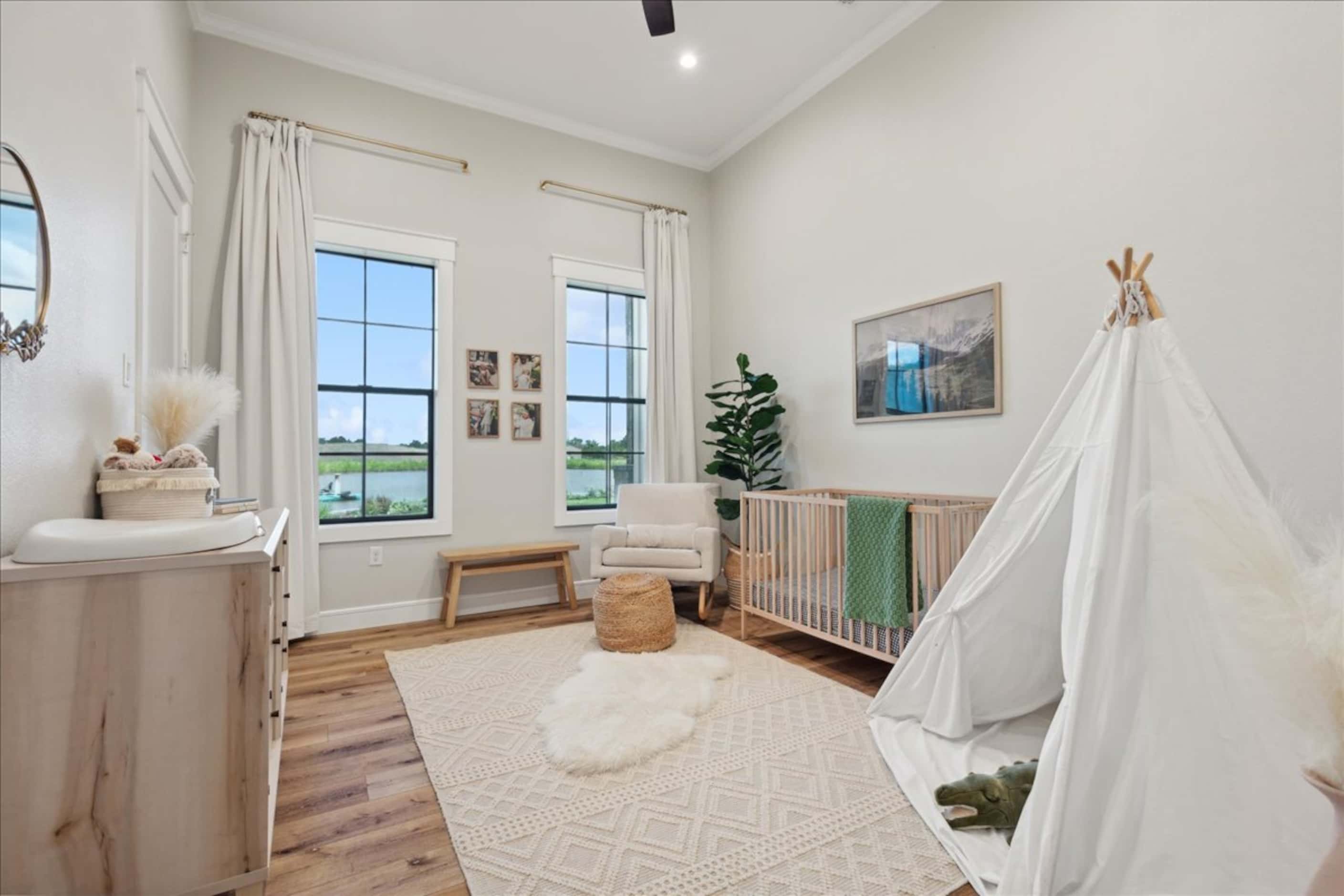 Child's bedroom with crib and teepee