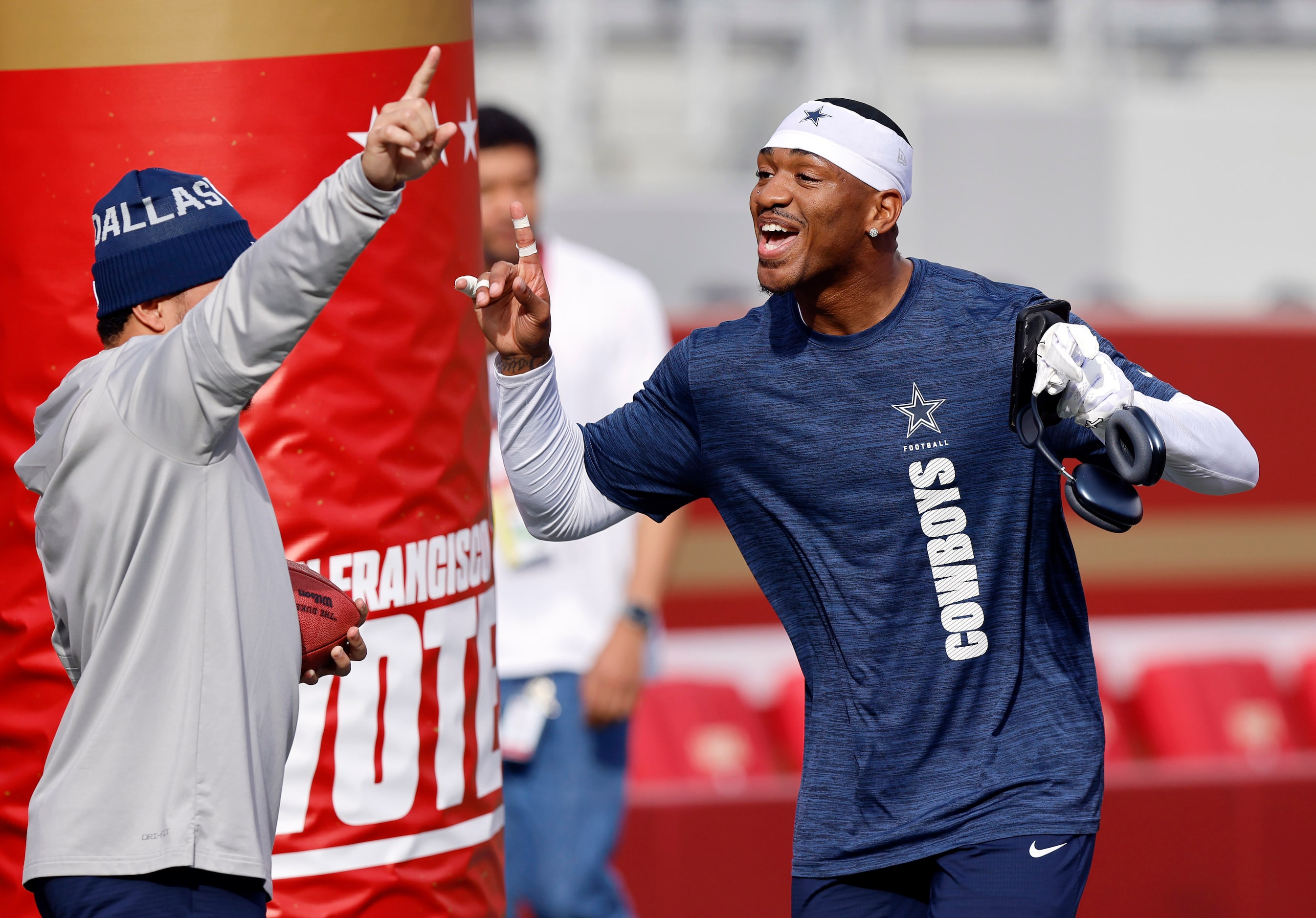 Dallas Cowboys safety Juanyeh Thomas (right) and running back Deuce Vaughn do a little dance...