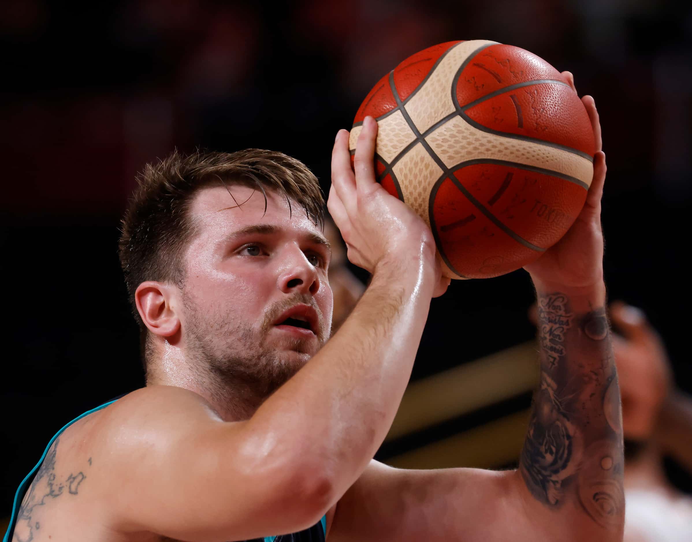 Slovenia’s Luka Doncic (77) shoots a free throw in a game against France’s during the first...