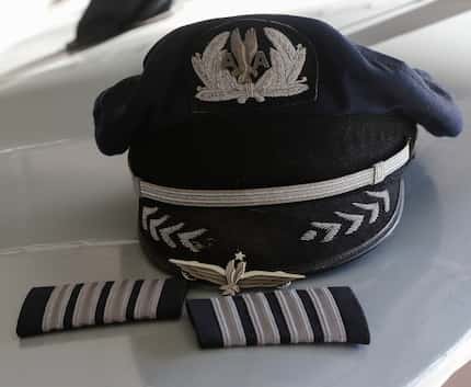 A hat, wings, and stripes that belong to retired American Airlines pilot Captain Jeff...