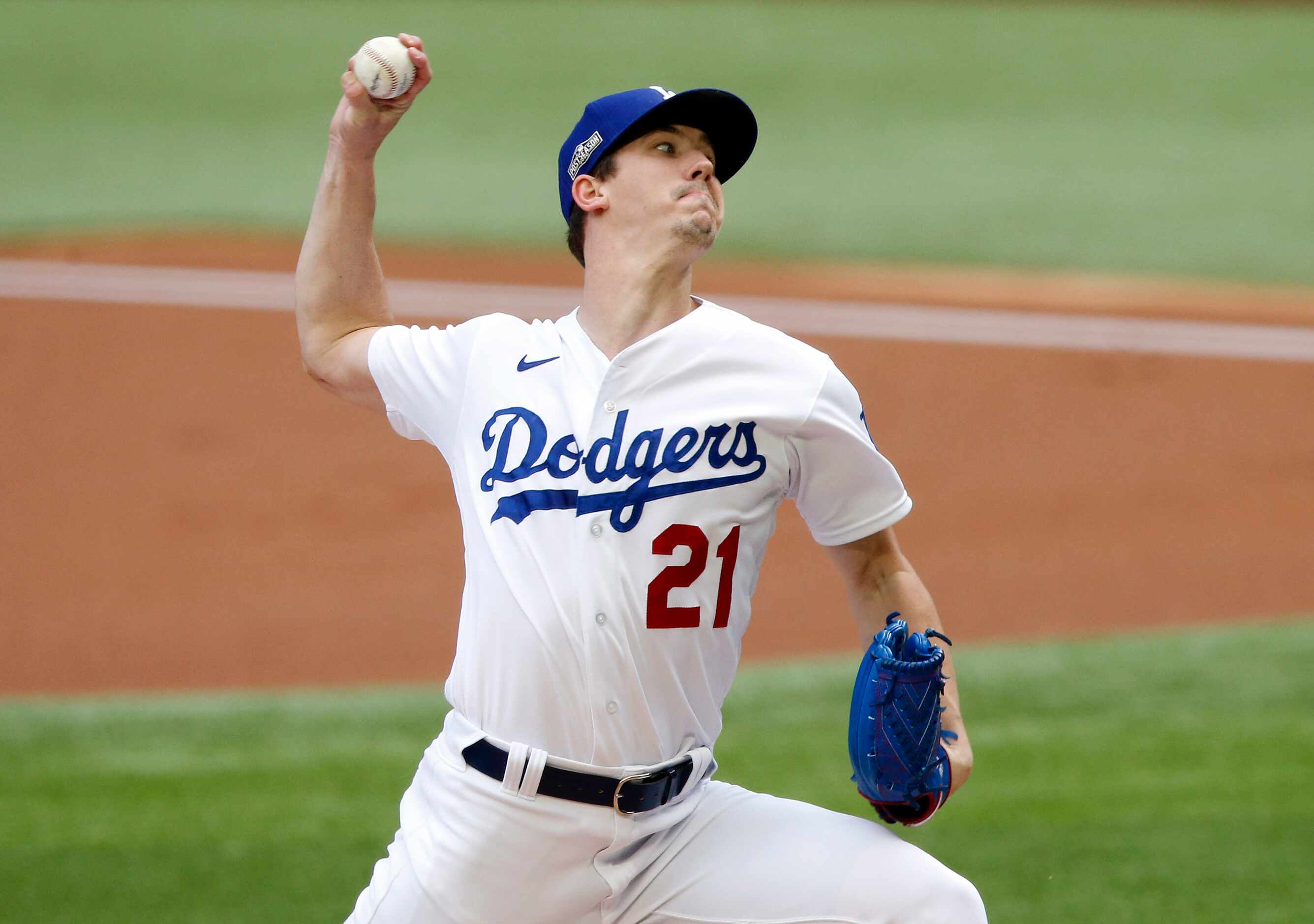 Los Angeles Dodgers starting pitcher Walker Buehler (21) throws against the top of the...
