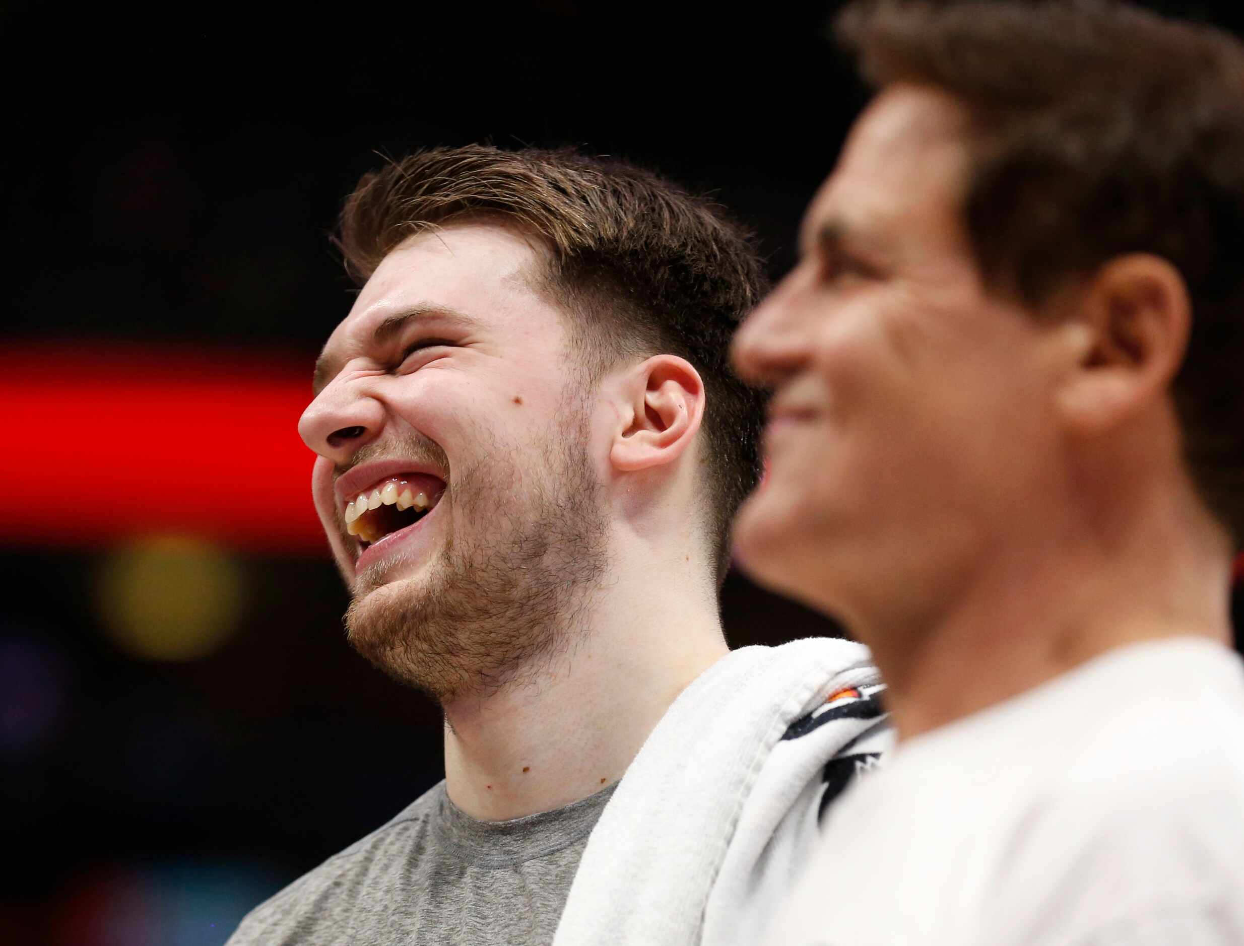 Dallas Mavericks guard Luka Doncic (77) shares a laugh with Dallas Mavericks owner Mark...