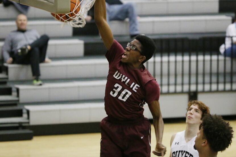 Wylie forward Ify Iwuji (3) dunks the ball in the second half of a high school basketball...