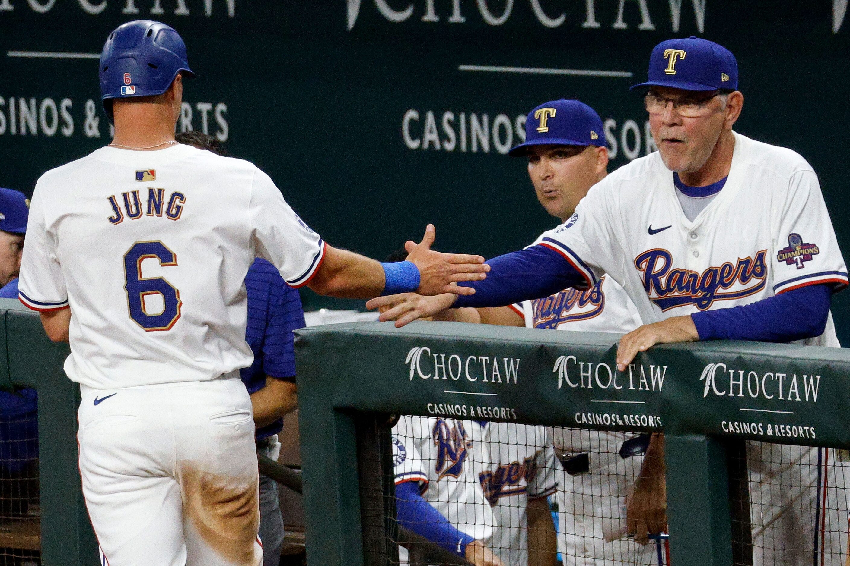 Texas Rangers third baseman Josh Jung (6) gets a high-five from Texas Rangers manager Bruce...