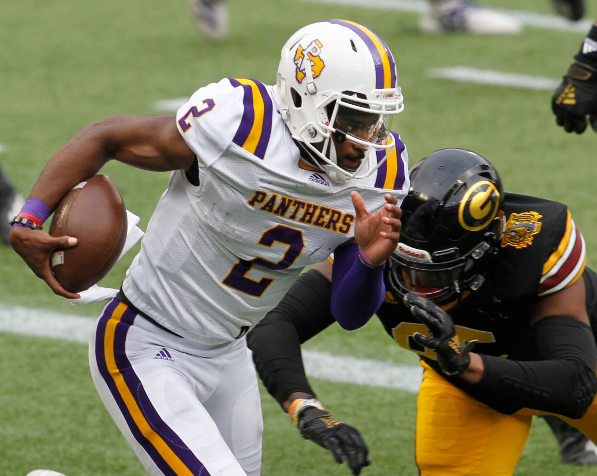 Prairie View A&M quarterback Tyriek Starks (2) scrambles out of the end zone around the...