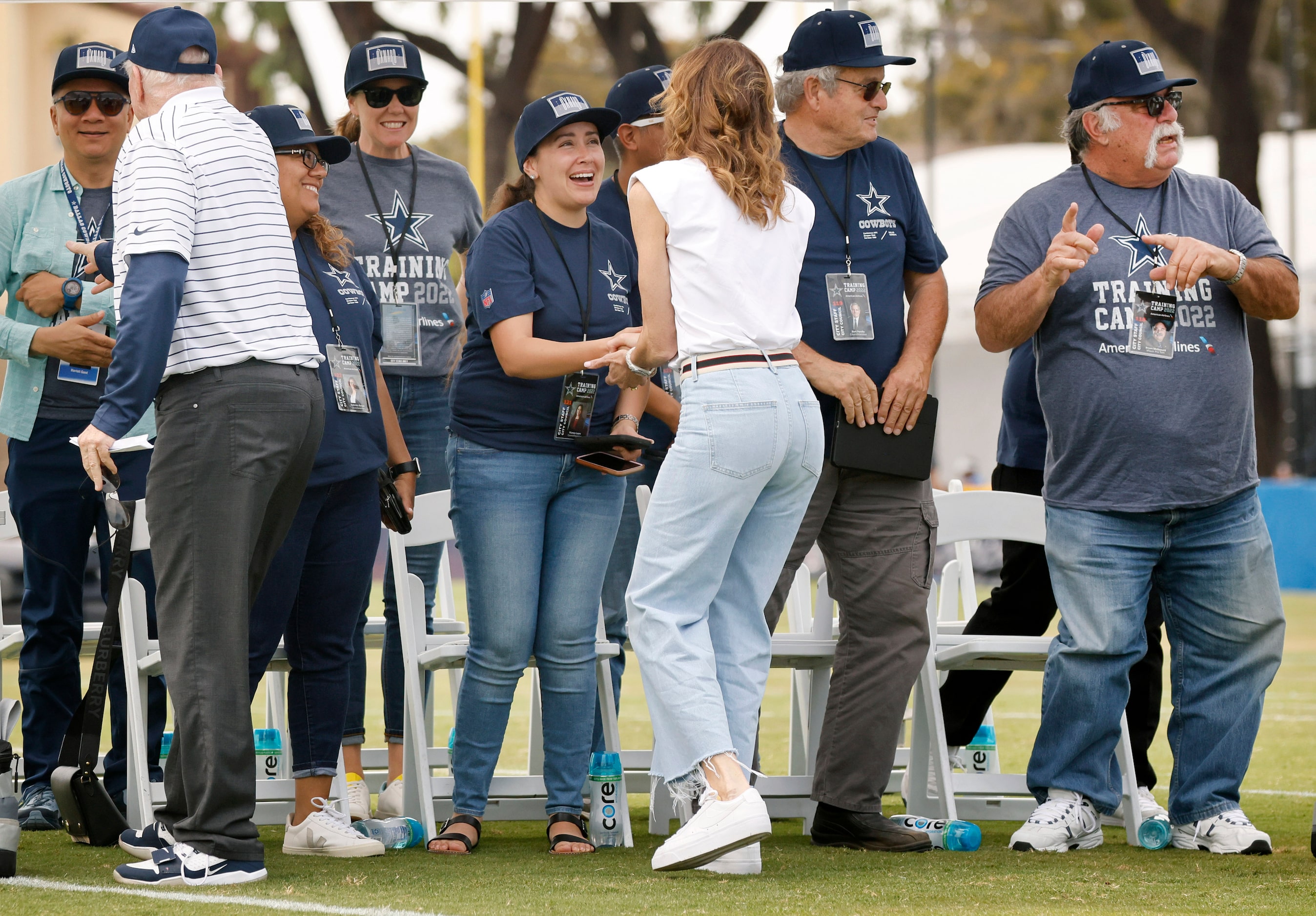 Dallas Cowboys owner Jerry Jones (back to camera, left), his daughter Charlotte Jones (back...