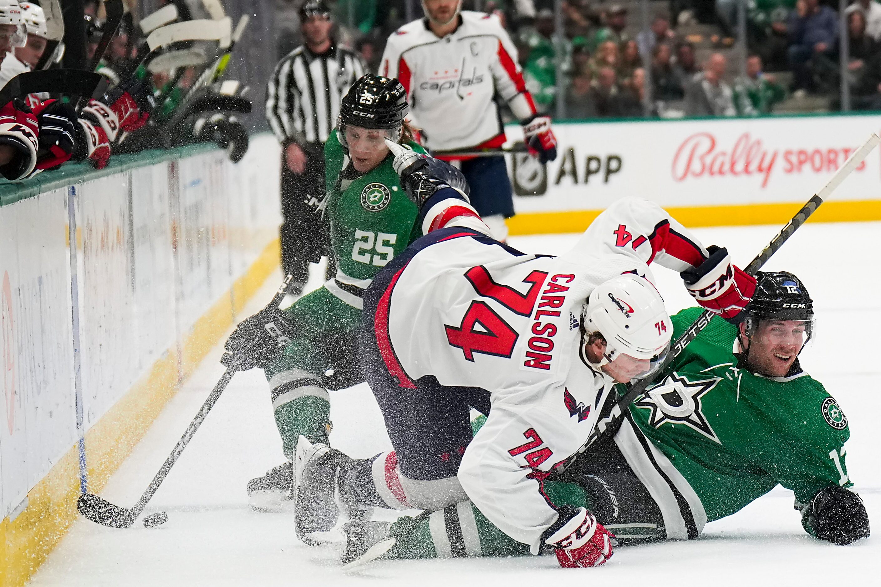 Dallas Stars center Radek Faksa (12) gets tied up along the boards with Washington Capitals...