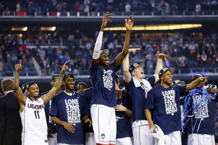 The Connecticut Huskies celebrate their 60-54 win over the Kentucky Wildcats in in the NCAA...