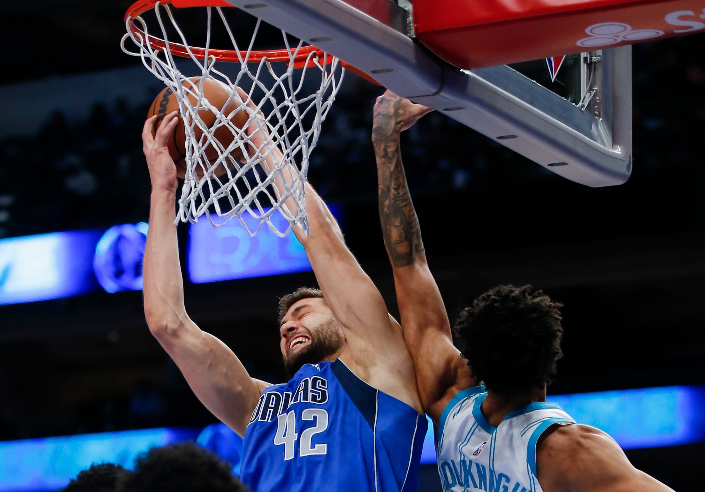 Dallas Mavericks forward Maxi Kleber (42) grabs a rebound away from Charlotte Hornets guard...