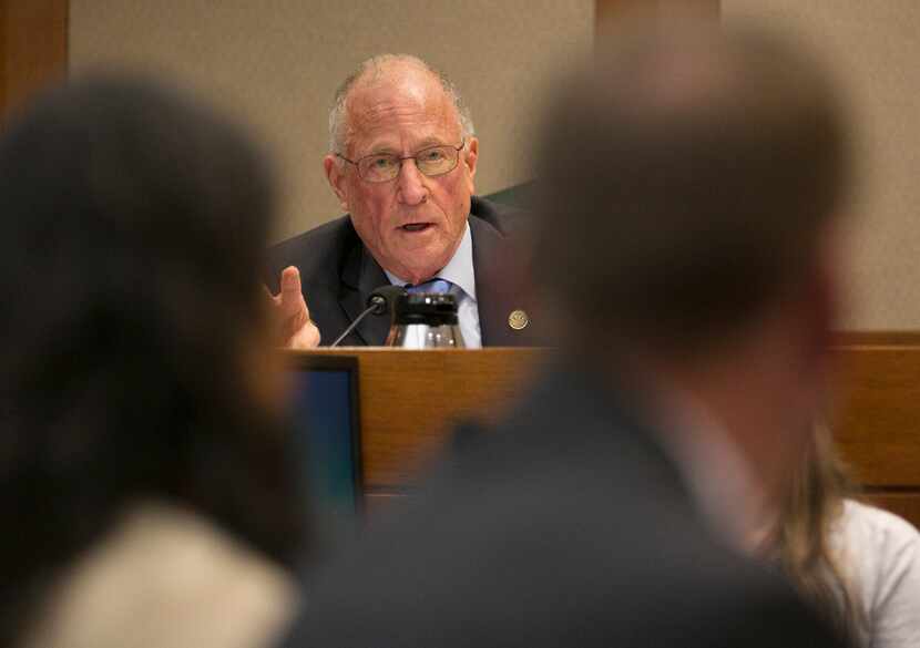 Senator Bob Hall addresses a person giving testimony on SB14 at the Senate Committee on...