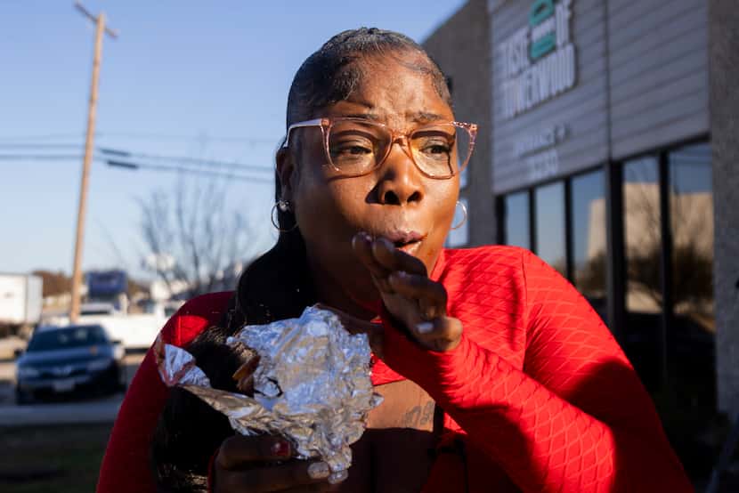 Ericka Watson is excited after taking a bite of her Nihari X Birria Taco order from Halal...