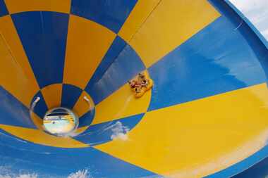 Taking a wild ride down the Tornado at Six Flags Hurricane Harbor in Arlington, the largest...