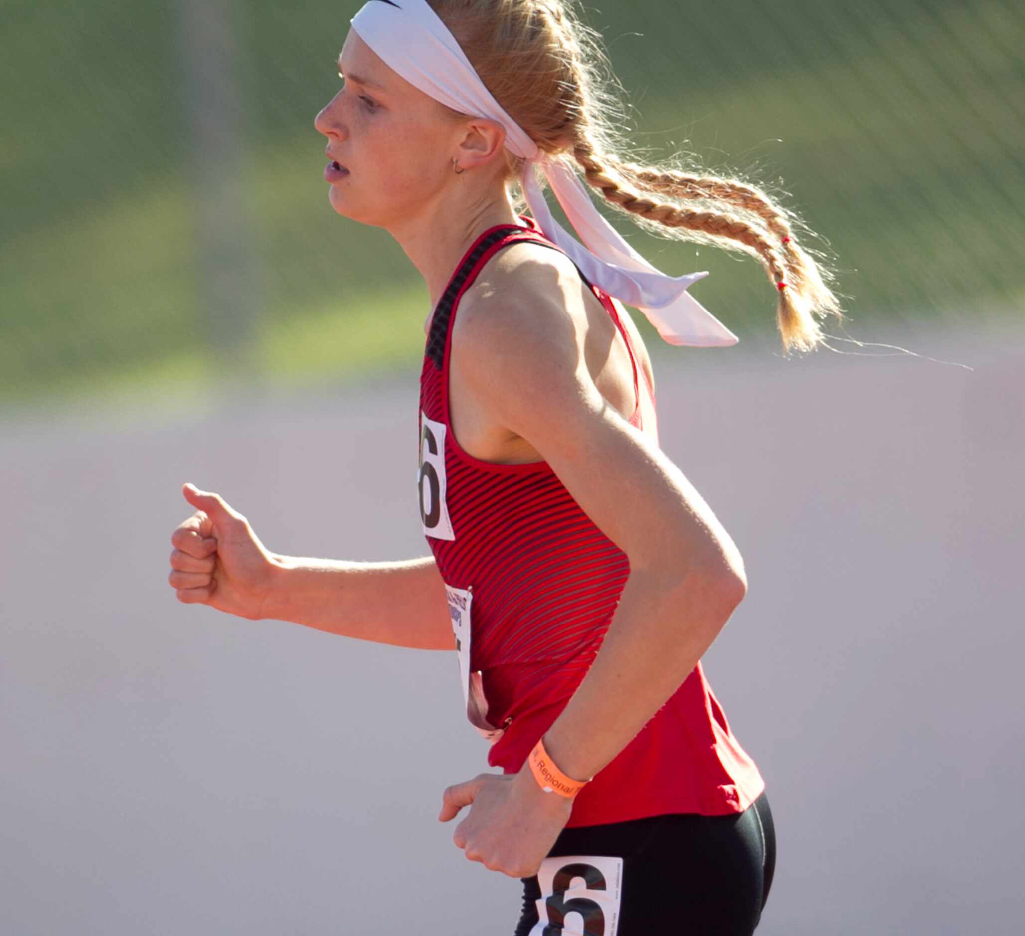 Lovejoy's Kailey Littlefield begins the bell lap enroute to her first place win in the Class...
