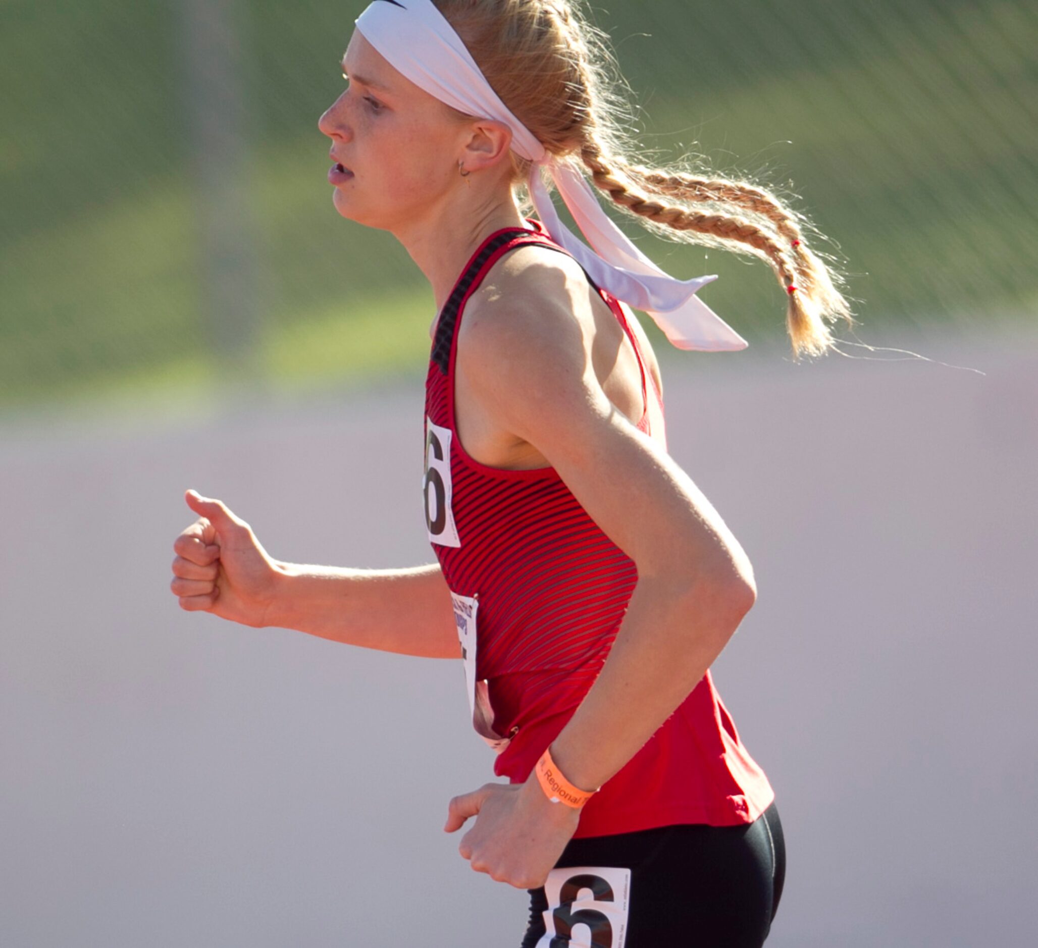 Lovejoy's Kailey Littlefield begins the bell lap enroute to her first place win in the Class...