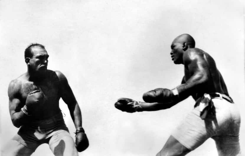  In this photo taken July 4, 1910, Jack Johnson (right) fights "Great White Hope" Jim...